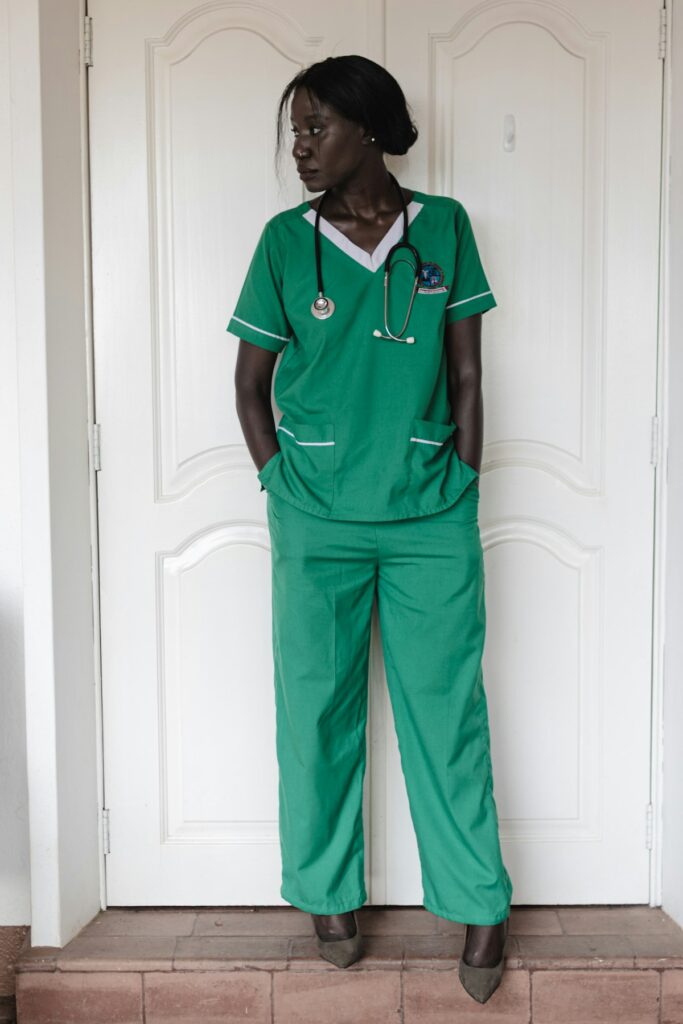 Healthcare worker in green scrubs with stethoscope – Texas hospital employees have legal protection against retaliation for reporting patient safety complaints