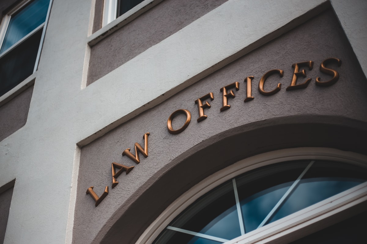 Law offices sign on building exterior – Texas wrongful termination attorney for Sabine Pilot claims