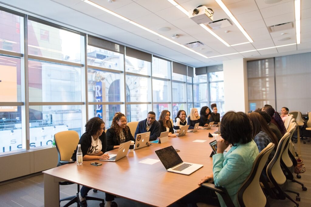 Diverse group of employees in a professional workplace meeting – Texas retaliation attorney Jack Nichols